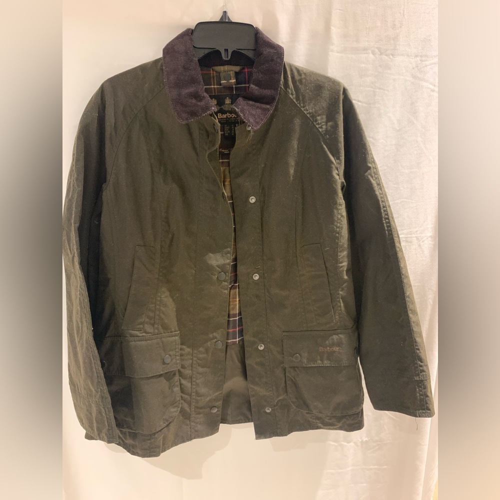 The Original Barbour Tarlan cotton Wax Jacket. Dark green, almost brown looking.
